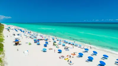 an overhead view of a beach with people and umbrellas at Ocean View Private Residence at South Beach - 804 in Miami Beach