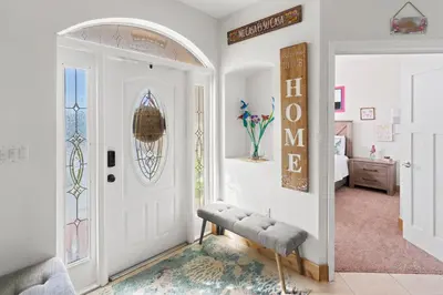 a room with a white door and a bench next to a bedroom at UPSCALE MANSION IN THE HEART OF MIAMI WITH POOL in Miami