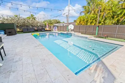 a swimming pool in the backyard of a home at UPSCALE MANSION IN THE HEART OF MIAMI WITH POOL in Miami