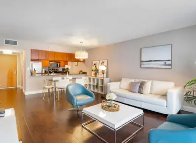 a living room with a couch and a table at Modern Vacation Apartment in Miami in Miami
