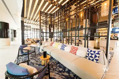 a library with a long couch and chairs in a room at 1 BR at Fort Lauderdale in Fort Lauderdale