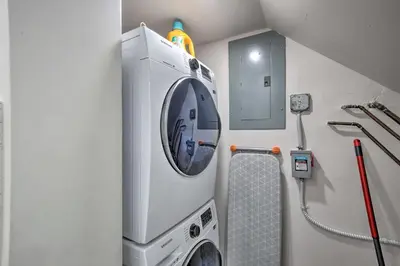 a laundry room with a washer and dryer at Canal-Front Condo Walk to Downtown Ft Lauderdale! in Fort Lauderdale