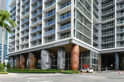 a large building with a lot of windows at Wonderful 2/2 Condo at Icon Brickell With Pool in Miami