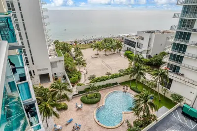 an overhead view of the pool and beach from a building at Hollywood Beach Ocean View Condo, Direct Beach Access, Pool & Resort Amenities in Hollywood