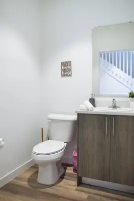 a bathroom with a toilet and a sink at Awesome 3BR Townhouse 15minutes from the Beach in Miami