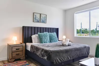 a bedroom with a bed with a teddy bear on it at Awesome 3BR Townhouse 15minutes from the Beach in Miami