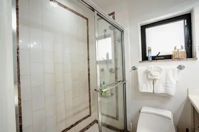 a bathroom with a shower and a toilet at B efficiency Off Las Olas on water free kayaks in Fort Lauderdale