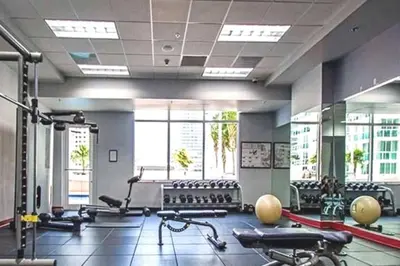 a gym with a lot of exercise bikes in it at Condo in Brickell Business District in Miami