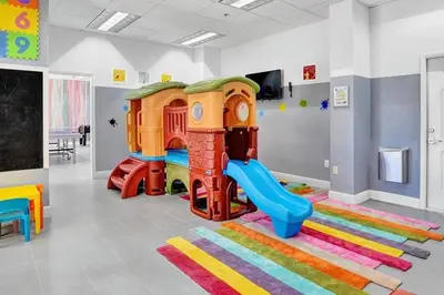 a play room with a playground with a slide at Condo in Brickell Business District in Miami