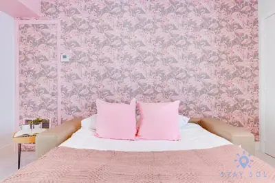 a pink bedroom with a bed with pink wallpaper at Free Parking, Bay View, Pool, Step To Beach in Hollywood