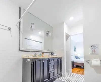 a bathroom with a sink and a mirror at Fun Family-Friendly Poolside Escape Near Beach in Dania Beach