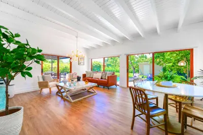 a living room with a table and chairs at Family-Friendly 4BR House with Pool in Westchester Miami in Tamiami