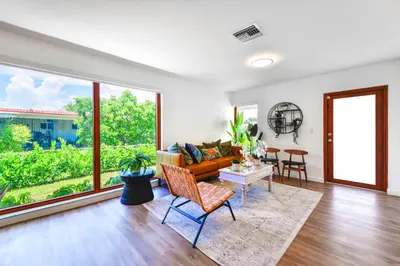 a living room with a couch and a table at Family-Friendly 4BR House with Pool in Westchester Miami in Tamiami