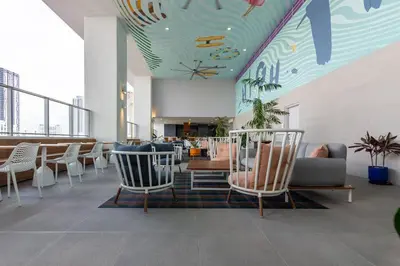 a lobby with chairs and a table and a ceiling with fishes at Amazing Condo in Downtown Miami/Brickell w/PARKING in Miami