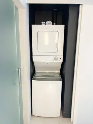 a white refrigerator with a microwave on top of it at 1 Bedroom with ocean and city views! in Fort Lauderdale