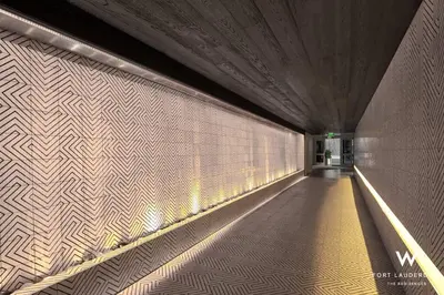 a tunnel with a wall with a light on it at 1 Bedroom with ocean and city views! in Fort Lauderdale