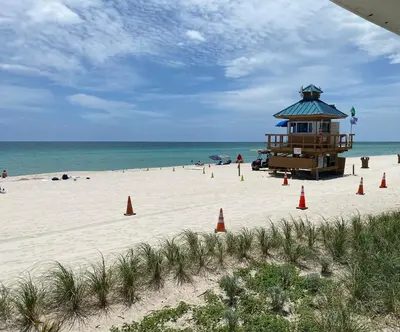 a lifeguard station on a beach with orange cones at Beachfront condo in Miami! in Sunny Isles Beach
