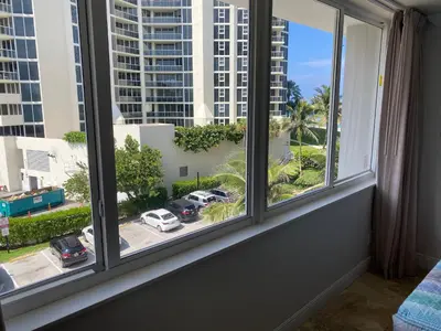 a window with a view of a parking lot at Beachfront condo in Miami! in Sunny Isles Beach