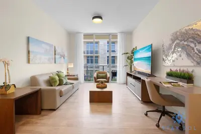 a living room with a couch and a desk with a computer at Perfect Relax - Rooftop Pool - Gym - Hot Tub in Hollywood