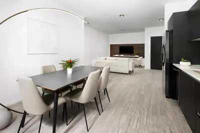 a kitchen and dining room with a table and chairs at The Elser Hotel Miami - An All-Suite Hotel in Miami