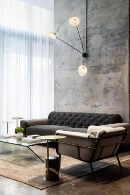a living room with a couch and a table at The Elser Hotel Miami - An All-Suite Hotel in Miami