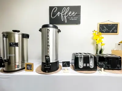 a shelf with two coffee machines and a toaster at The Delmar in Hollywood