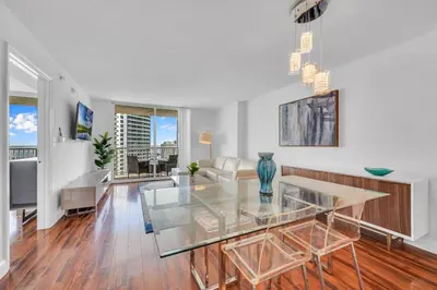 a living room with a glass table and a couch at 40th floor Ocean View - Best Location in Miami