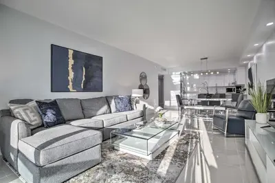 a living room with a couch and a table at Less Than Half-Mi to Beach Sunny Isles Resort Condo in Miami Beach
