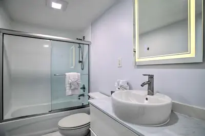 a bathroom with a sink and a toilet and a shower at Less Than Half-Mi to Beach Sunny Isles Resort Condo in Miami Beach