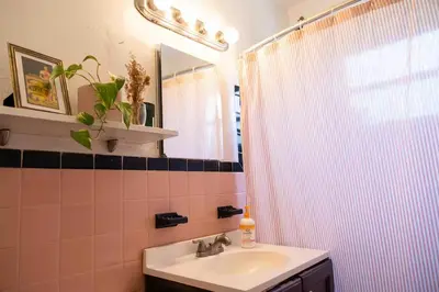 a bathroom with a sink and a shower at Cozy Room near Miami Airport in Miami