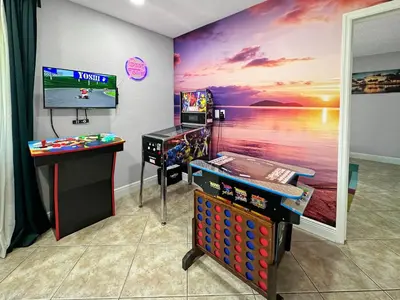 a room with a room with a video game system at Vacay Spot Happy Escape 15 Min Beach Massage Shower Prime LOC! 6 blocks away from Bars, Nite Clubs, Res, Shops in Miami