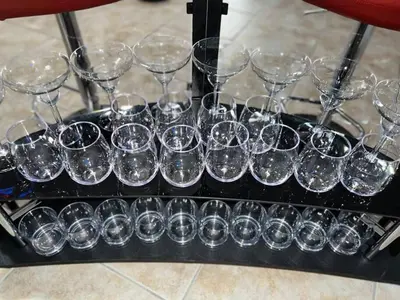 a group of wine glasses sitting on a tray at Vacay Spot Happy Escape 15 Min Beach Massage Shower Prime LOC! 6 blocks away from Bars, Nite Clubs, Res, Shops in Miami