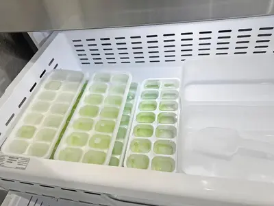 a white container with green food inside of a refrigerator at Vacay Spot Happy Escape 15 Min Beach Massage Shower Prime LOC! 6 blocks away from Bars, Nite Clubs, Res, Shops in Miami