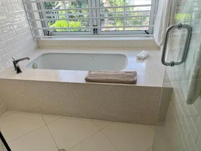 a bath tub in a bathroom with a window at Direct Ocean View - Luxurious condo in South Beach in Miami Beach