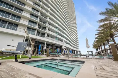 a swimming pool in front of a building at Zen Vacation Rentals Ocean front 3 3 MAZAL in Hollywood
