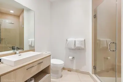 a bathroom with a sink and a toilet and a shower at Zen Vacation Rentals Direct Ocean Front Low Floor in Hollywood