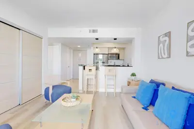 a living room with a couch and a table at Beachfront Resort - Pool - Ocean View Balcony- Gym in Miami Beach