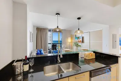 a kitchen with a sink and a counter top at Beachfront Resort - Pool - Ocean View Balcony- Gym in Miami Beach