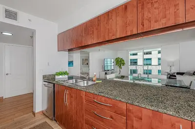a kitchen with a sink and a counter top at Miami condo with city & ocean views! Sleep up to 6! in Miami