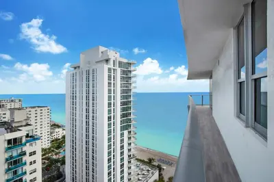 a view of the ocean from the balcony of a building at Zen Vacation Rentals Ocean Front at Lyfe Resort in Hollywood