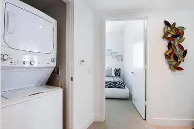 a kitchen with a white appliance in a room at Million Dollar Ocean Front Penthouse by Zen Vacation Rentals in Hollywood