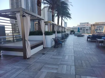 a balcony with benches and chairs on a building at Modern Waterfront Retreat with Scenic Views in Hollywood