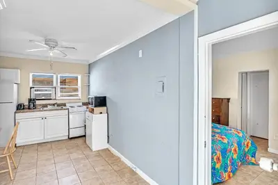 a room with a kitchen and a bed in it at Charter House in Hollywood