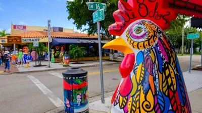 a statue of a chicken on the side of a street at 5 Minutes to downtown Apt201 in Miami