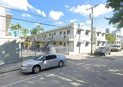 a silver car parked on the side of a street at 5 Minutes to downtown Apt201 in Miami