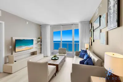 a living room with a view of the ocean at Insane Ocean View Balcony - Beachfront Condo - Pool in Hollywood