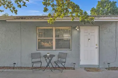 two chairs and a table in front of a house at Hollywood Vacation In Perfect Beach Location Ha01 in Hollywood