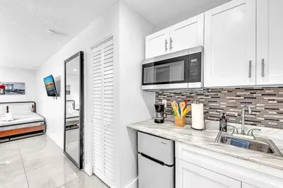 a kitchen with a sink and a microwave at New 2 Bed Studio Close To Beach & Casino Ha04 in Hollywood