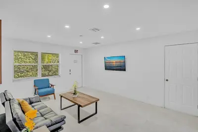 a living room with a couch and a table at NEW 2 Bedroom Hollywood Beach and Hard Rock LB1 in Hollywood