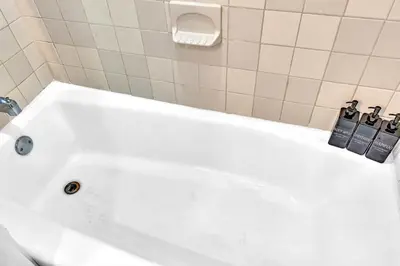 a white bath tub in a bathroom at Hollywood 2 Bdrm New Furnished Beach Vacation LB2 in Hollywood